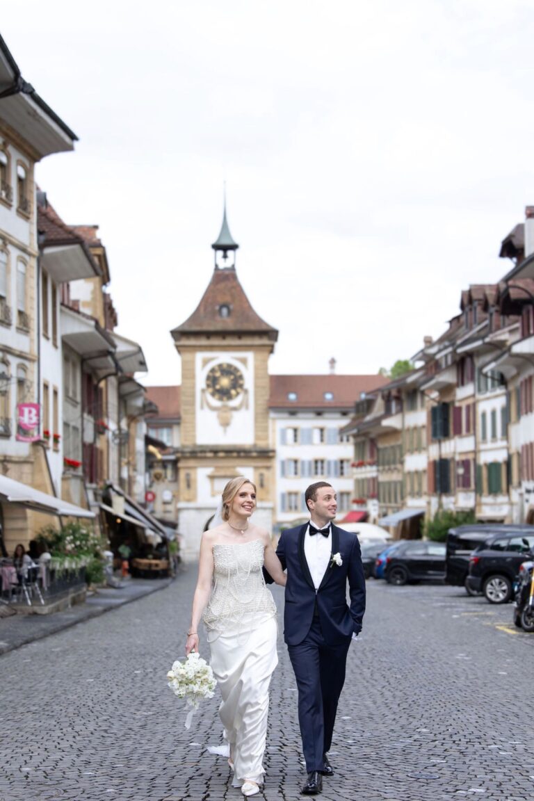 Couple walking through a medieval Swiss town, Daria Events and Weddings
