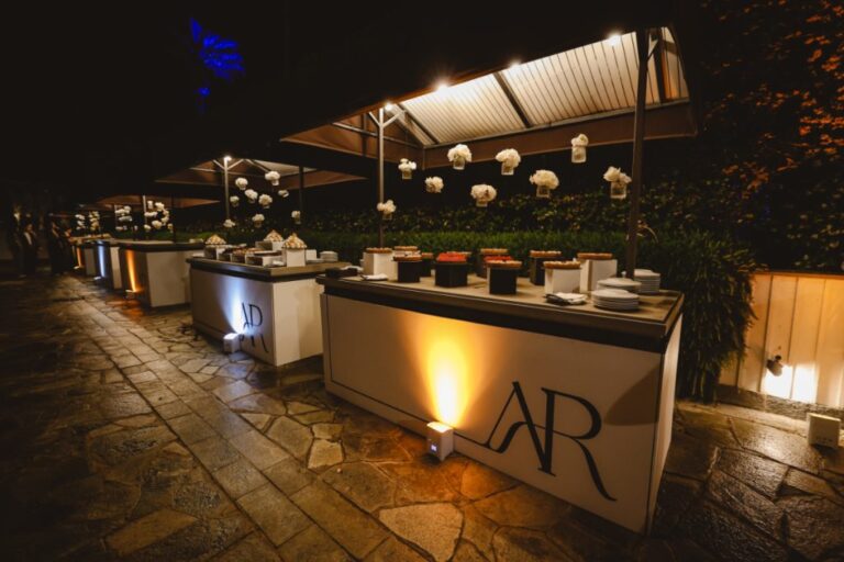 Outdoor bar counters lit from below, carrying the couple's monogram, Dario Varsalona