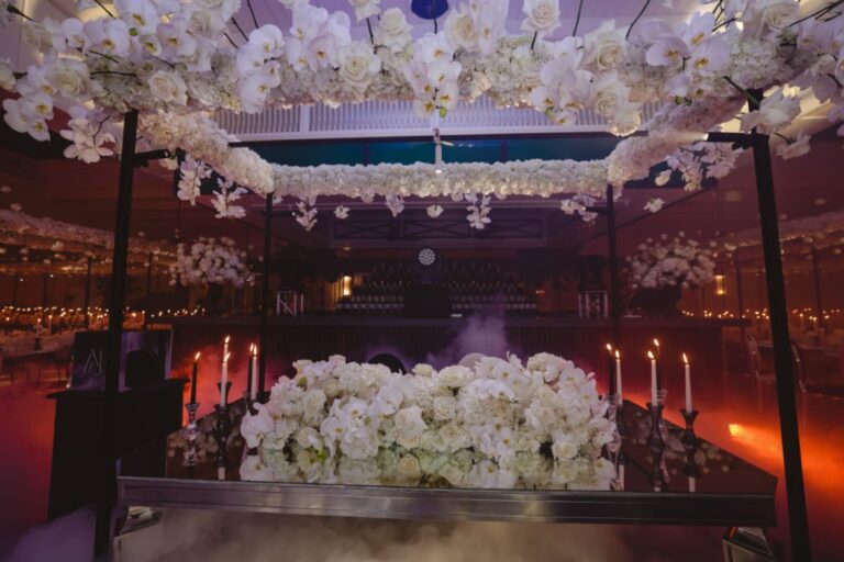 Reception table under a ceiling of white blossom, candles and dry ice, Dario Varsalona