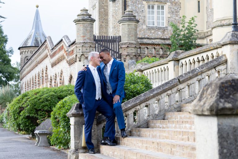 Two grooms on the stone steps of the terrace beside the mansion, De Vere Horsley Estate