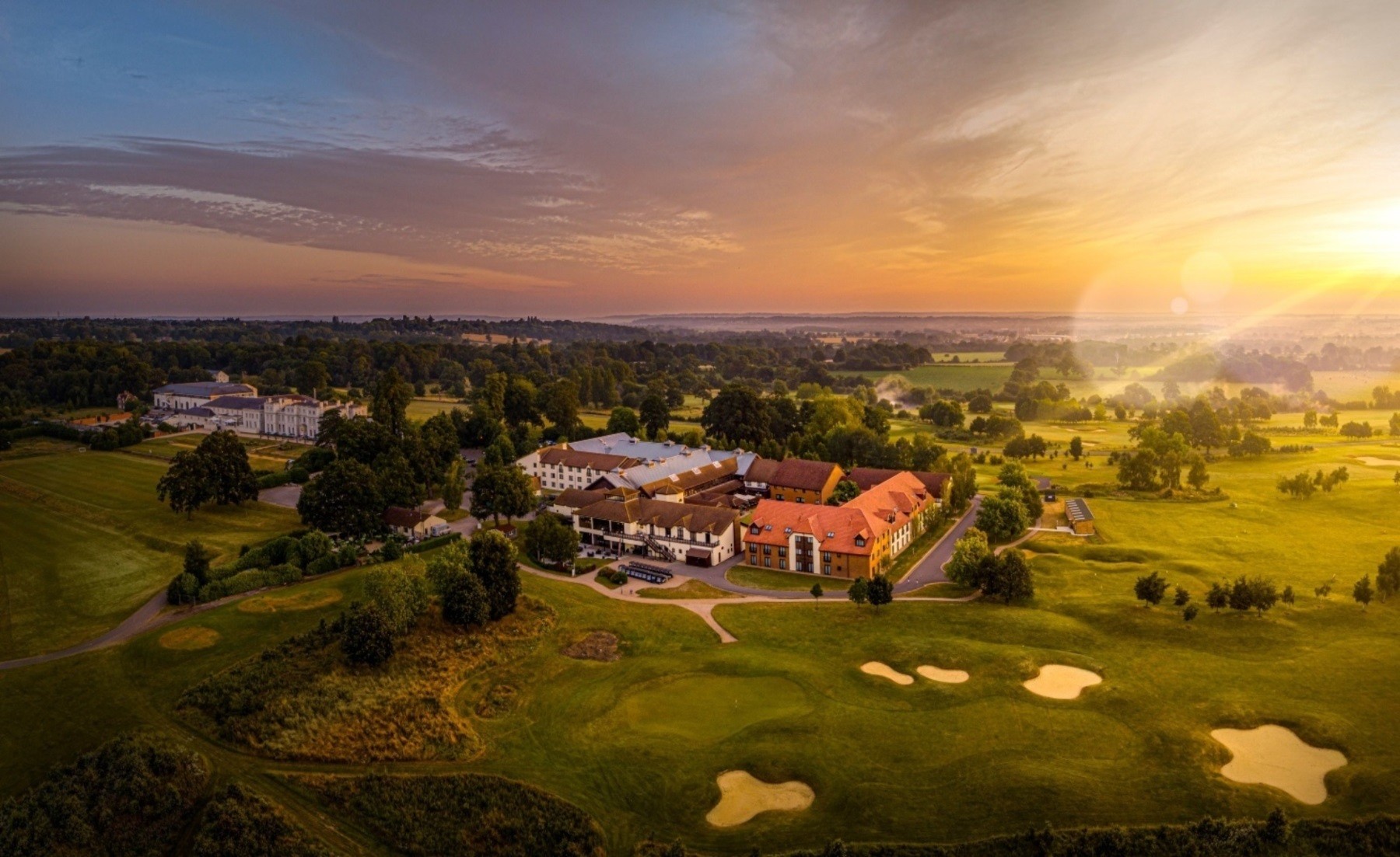 Aerial view of the estate at sunset, De Vere Wokefield Estate