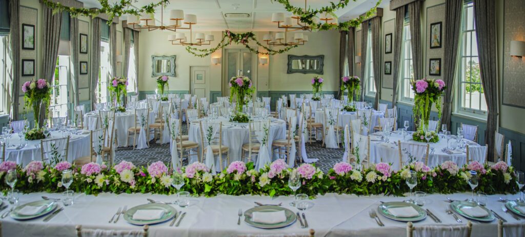 A long top table with flowers along its length, De Vere Wokefield Estate