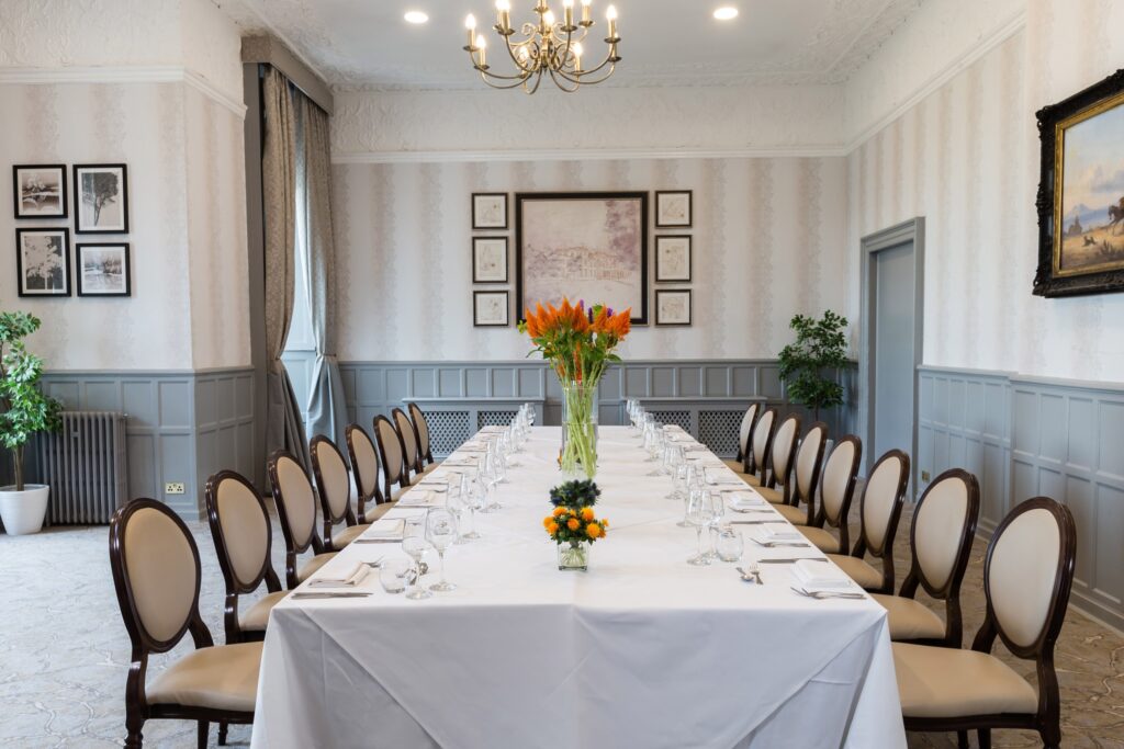 A long table laid in a panelled room, De Vere Wokefield Estate