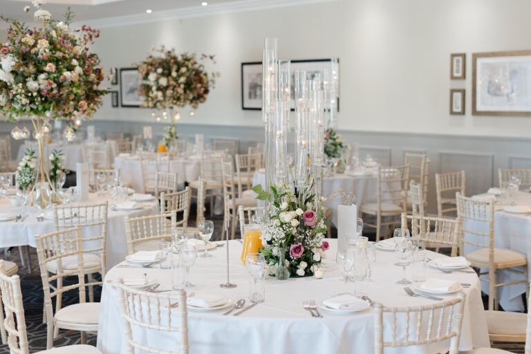 Tables laid with candles and flowers, De Vere Wokefield Estate