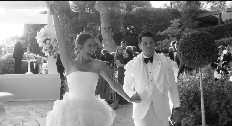A couple leave their ceremony hand in hand at Four Seasons Cap Ferrat, in black and white, Denee Motion