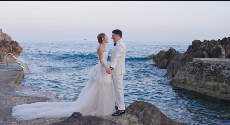 A couple on the rocky shore below Four Seasons Cap Ferrat, Denee Motion