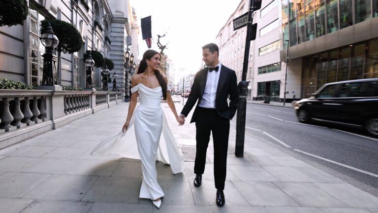 S and N walk hand in hand along the street outside Rosewood London (still from their film), Denee Motion