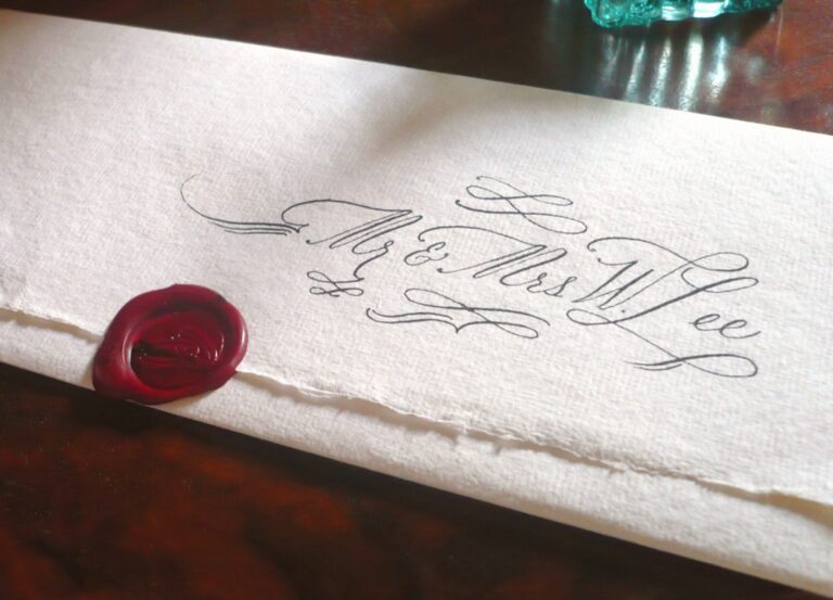 Hand-addressed envelope on deckle edged paper with a red wax seal, Denise Hagon Calligrapher
