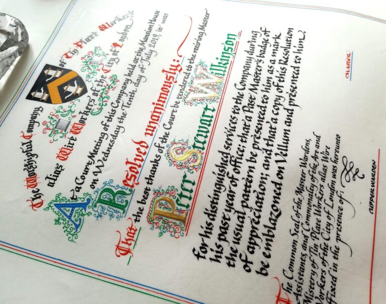 An illuminated resolution with coloured capitals, gilding and a coat of arms, Denise Hagon Calligrapher