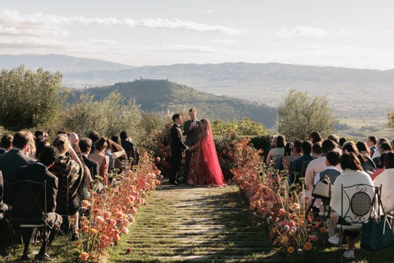 An outdoor ceremony facing the Umbrian hills at Castello di Petrata, Denise More