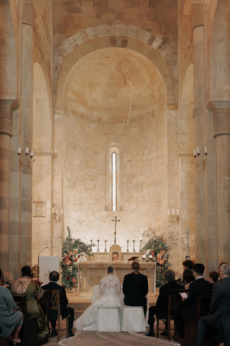 A ceremony at the altar of a Romanesque church in Tuscany, Denise More