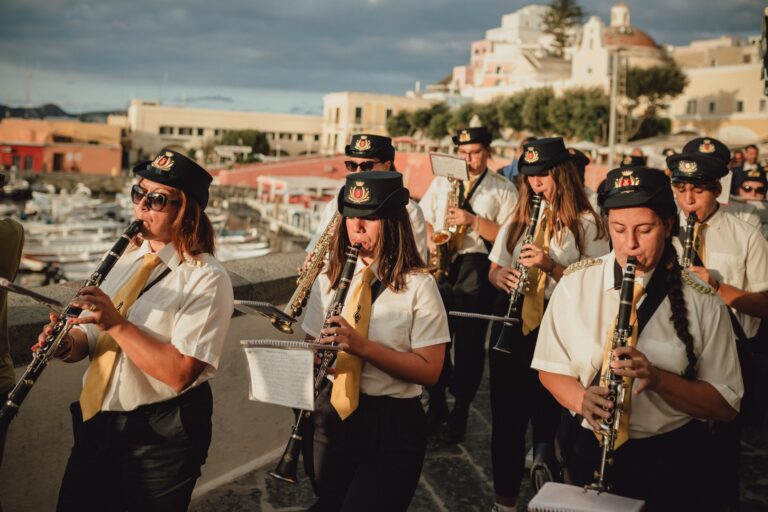 The local band leading the wedding procession through Ponza harbour, Denise More