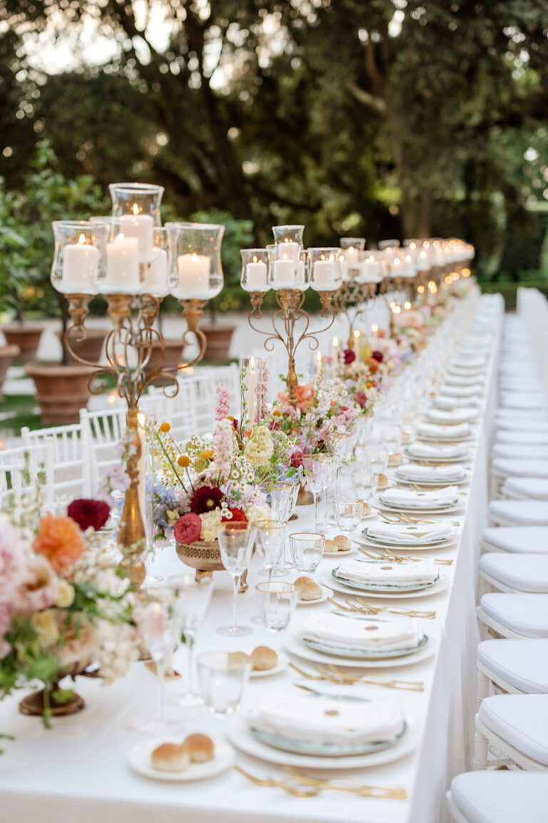A long table at Villa Aurelia dressed with candelabra and mixed pastel flowers, Denise More