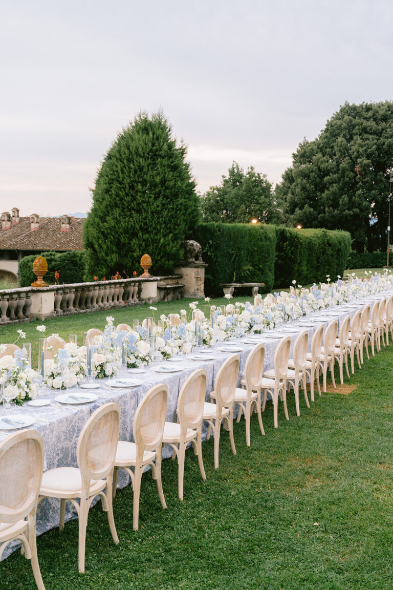A long dinner table on the lawn at Tenuta di Artimino, Tuscany, Denise More
