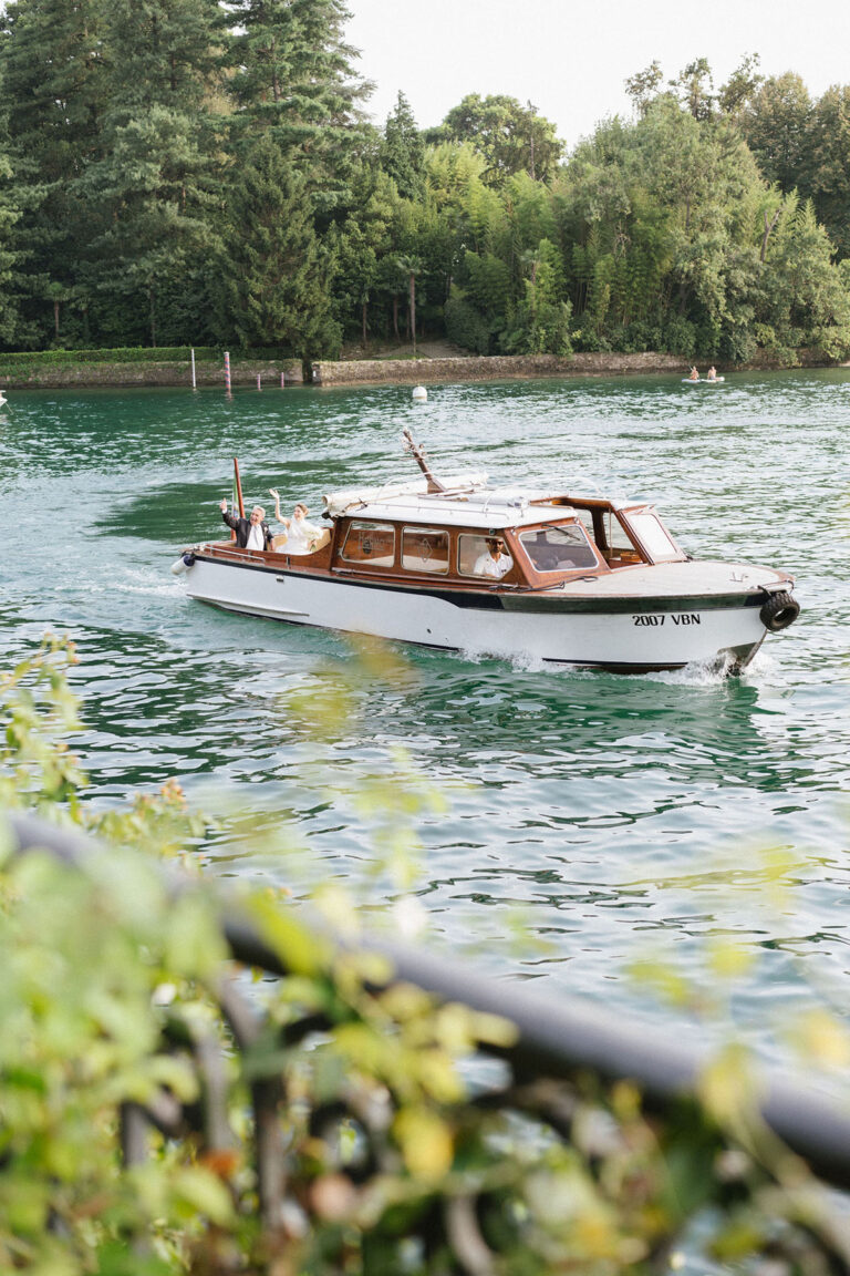 A wooden motor launch crossing Lake Maggiore, Denise More