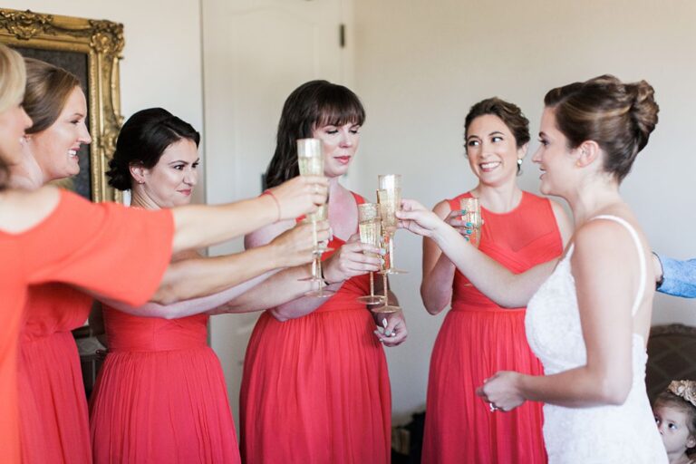 Bridesmaids and the bride raising a toast before the ceremony, Despina Craig Events