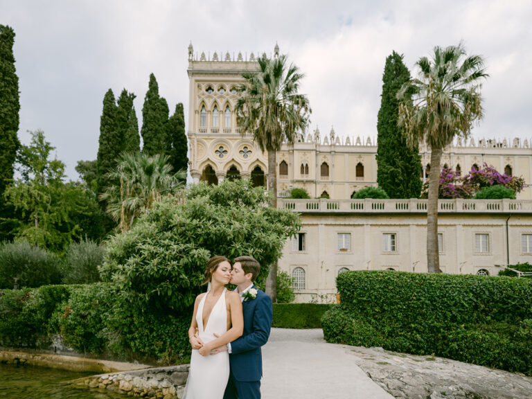 The couple in the formal garden in front of the villa. Sam and Lance's elopement on Garda Island, Lake Garda, Detito Photography