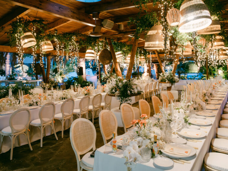 Dinner tables under hanging lanterns and greenery for the reception on Ischia. Erica and Dustin's wedding at the Aragonese Castle, Ischia, Detito Photography