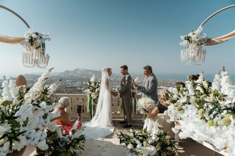 Vows among banks of white flowers above the caldera, Santorini, Diamond Rock Santorini
