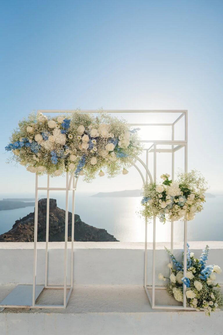 Blue and white floral stands at Astra Chapel, Santorini, Diamond Rock Santorini
