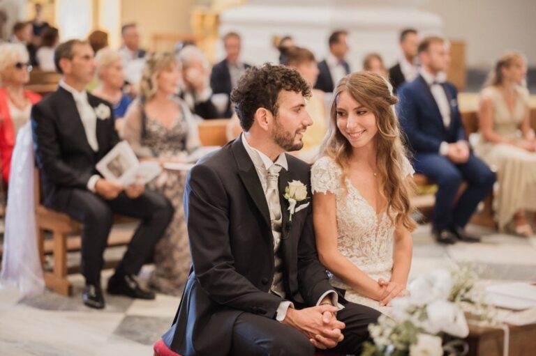 Bride and groom in a church pew, in black and white, Diego Giusti Photographer