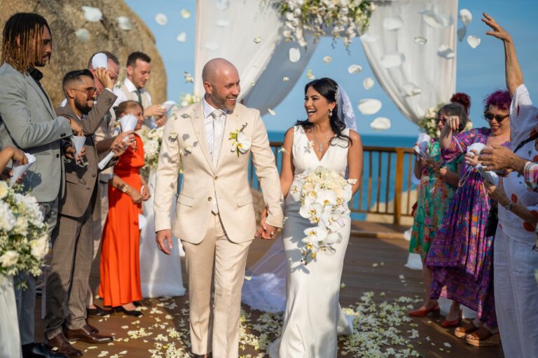 Friends throw petals as the couple leave the ceremony, Dimas Frolov Photography