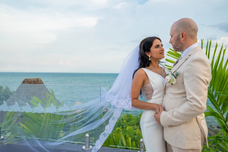 The couple and a long lace veil against the sea, Dimas Frolov Photography