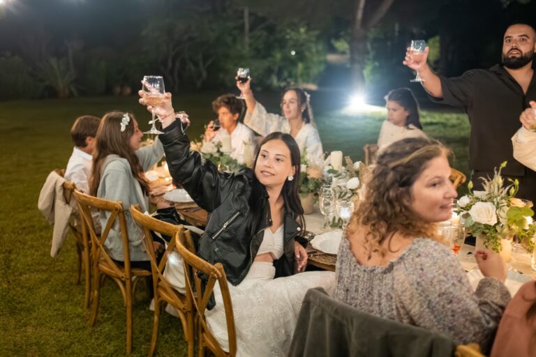 Guests raise a toast at the long dinner table in the garden, Casal do Frade, Sesimbra, Dimas Frolov Photography