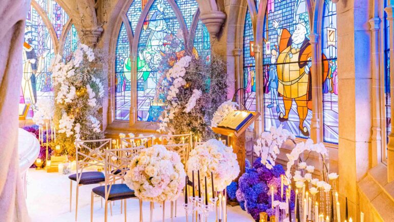 Ceremony in the Sleeping Beauty Castle gallery with floral arrangements, Disneyland Paris