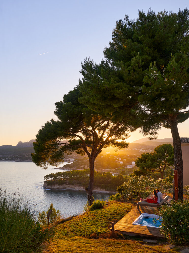 Sunset through the pines above a cove, Domaine de Canaille