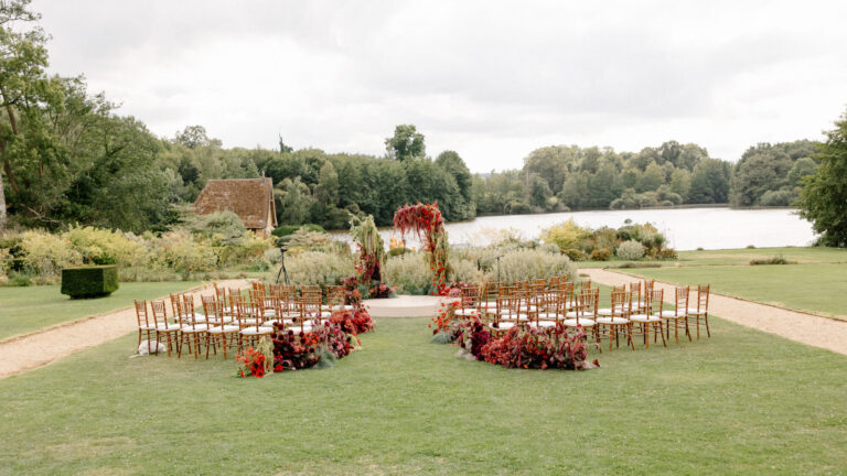 Ceremony seating on the lawn beside the lake, Domaine des Etangs, Auberge Collection