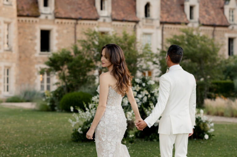 A couple in the gardens in front of the château, Domaine des Etangs, Auberge Collection
