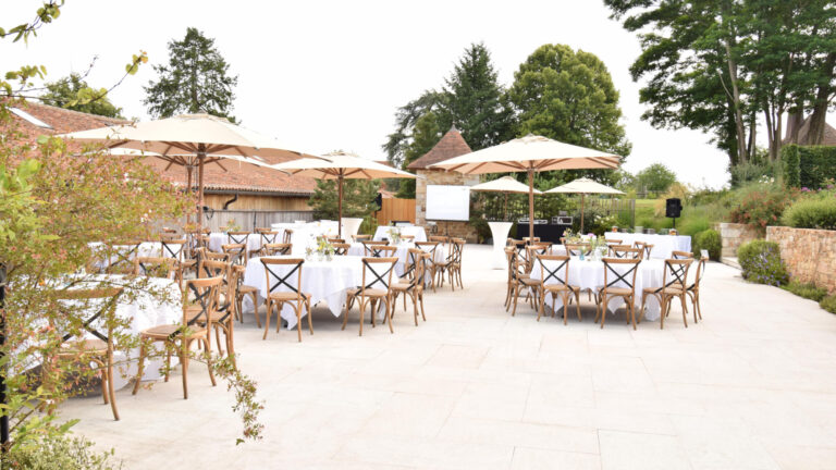 The La Laiterie terrace set for a reception, Domaine des Etangs, Auberge Collection