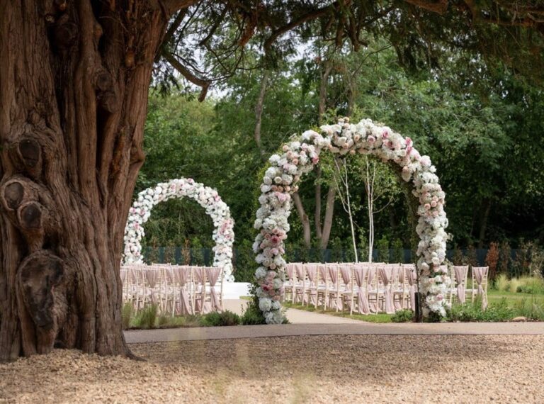 Two floral arches set up in the grounds, Down Hall Country House Hotel