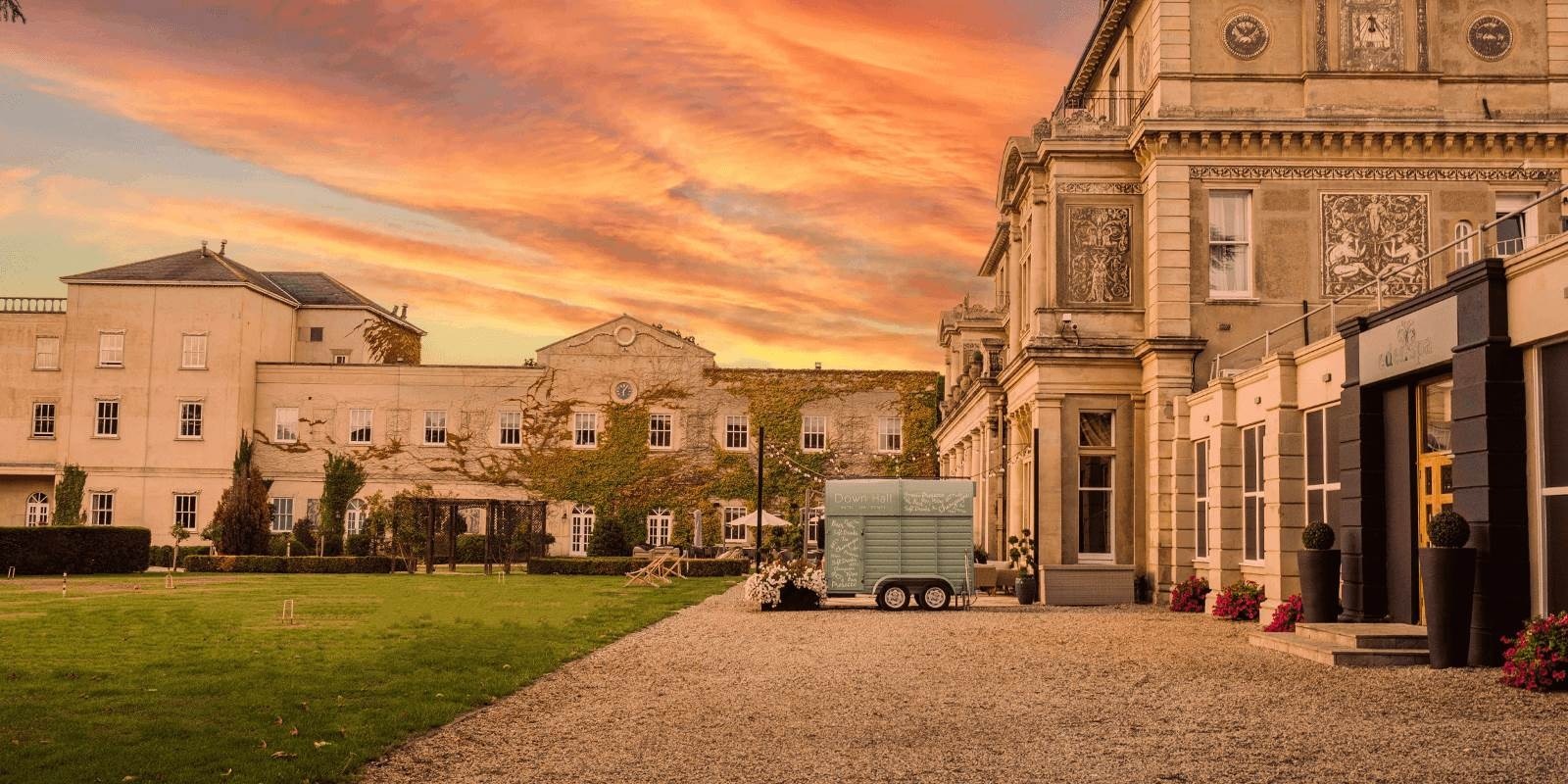 The mansion front at sunset, Down Hall Country House Hotel