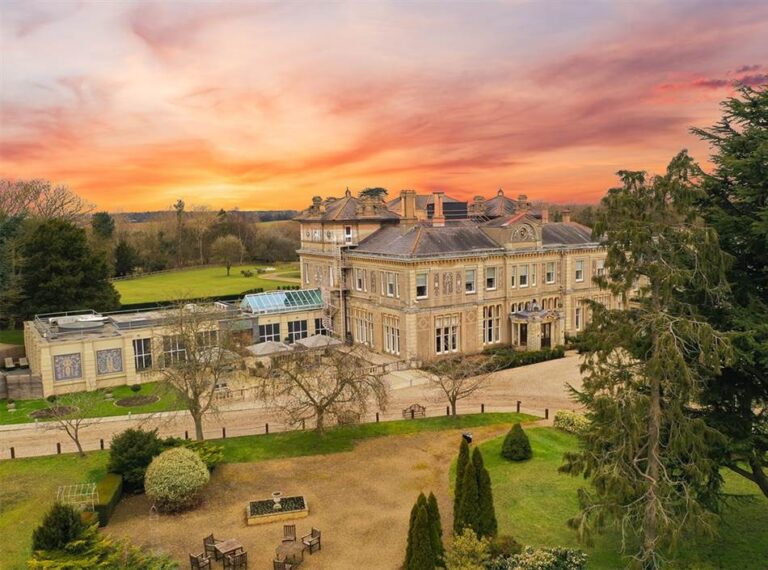 Aerial view of the mansion and grounds at sunset, Down Hall Country House Hotel