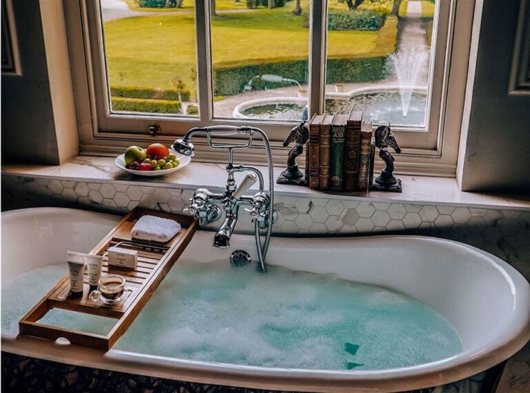 A bathroom with a freestanding bath, Down Hall Country House Hotel