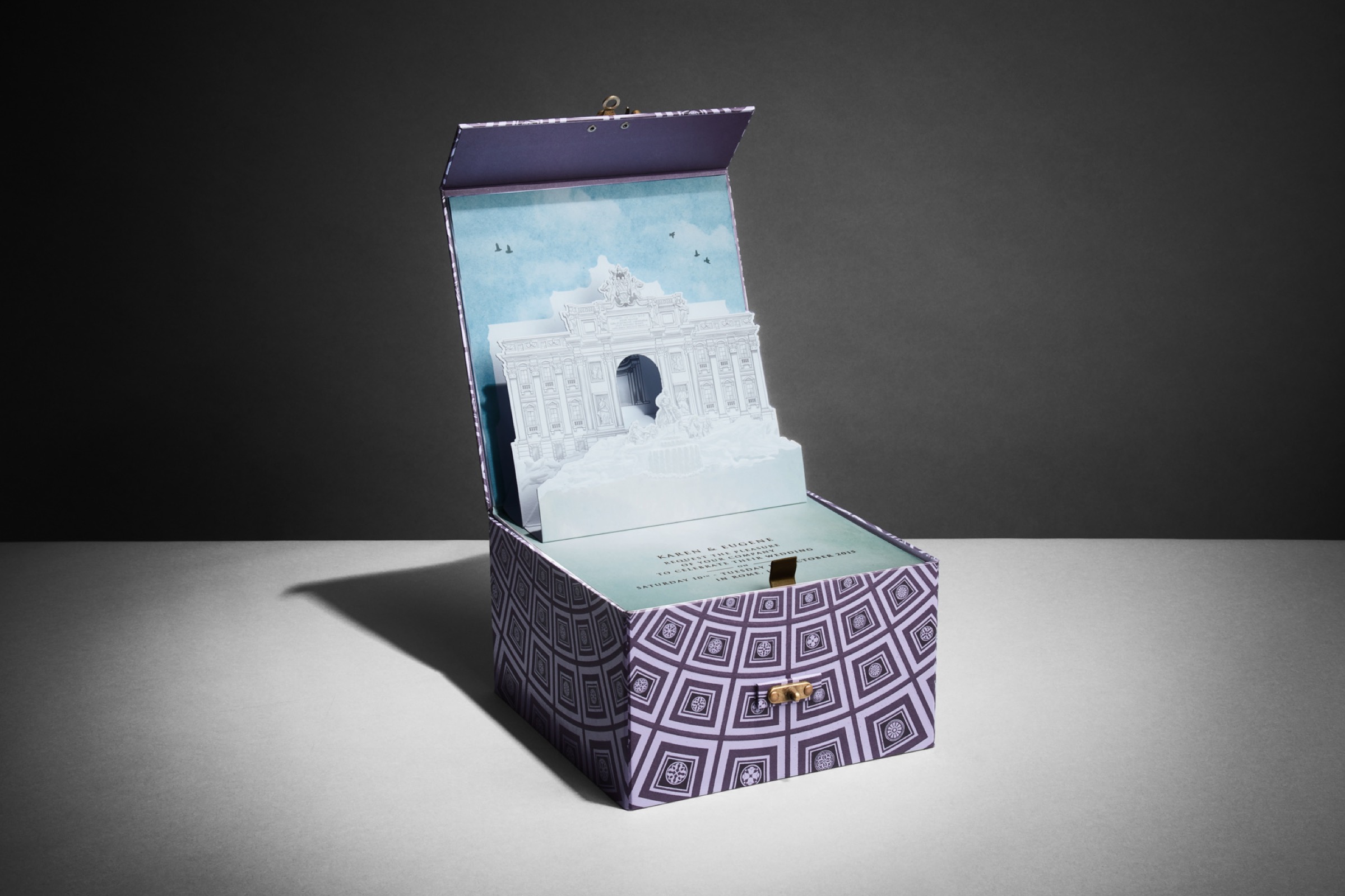 Wedding invitation box opened to reveal a three-dimensional pop-up of the Trevi Fountain, made for a wedding in Rome, Downey Luxury Stationery