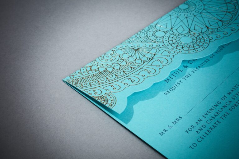 Turquoise invitation with a gold foil geometric floral pattern and scalloped edge, Downey Luxury Stationery