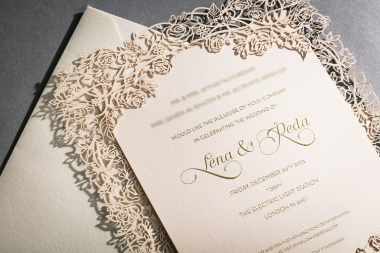 Gold-printed wedding invitation framed by a laser-cut rose bush border, Downey Luxury Stationery