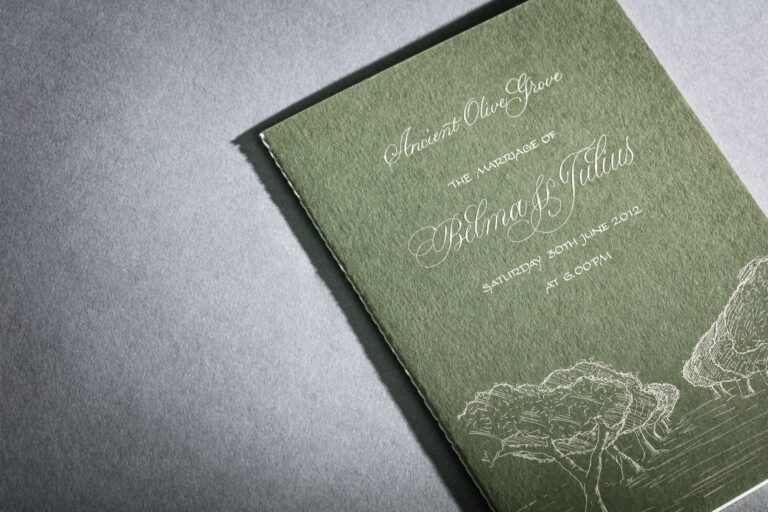 Green invitation booklet with a cream engraved olive tree illustration, for a wedding at an olive grove in Greece, Downey Luxury Stationery