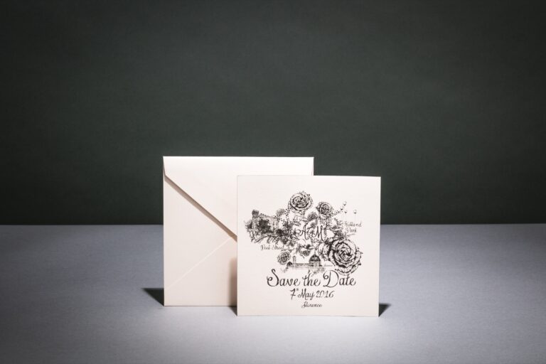 Save the date card with a hand-illustrated floral monogram, shown with a vellum-style envelope, Downey Luxury Stationery