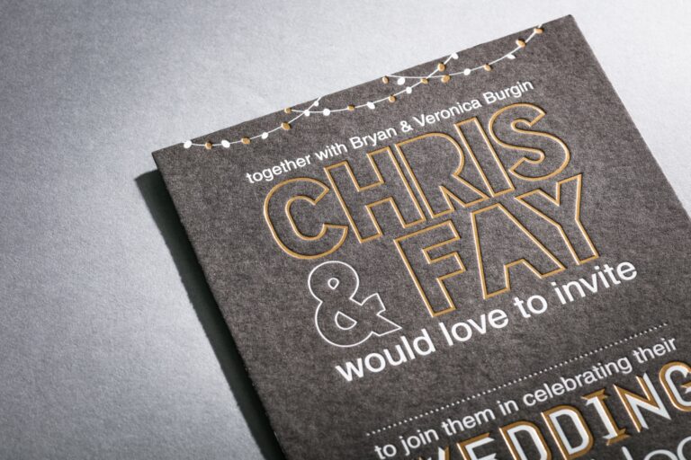 Gold foil lettering with string lights illustration on charcoal stock, Downey Luxury Stationery