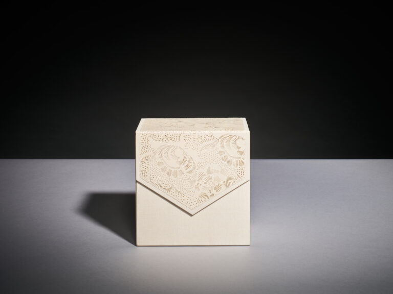 Linen invitation box with a laser-cut floral flap, photographed face on, Downey Luxury Stationery