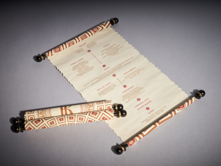 Hand-torn scroll dinner menu tied with leather cord, designed for the wedding in Rome, Downey Luxury Stationery