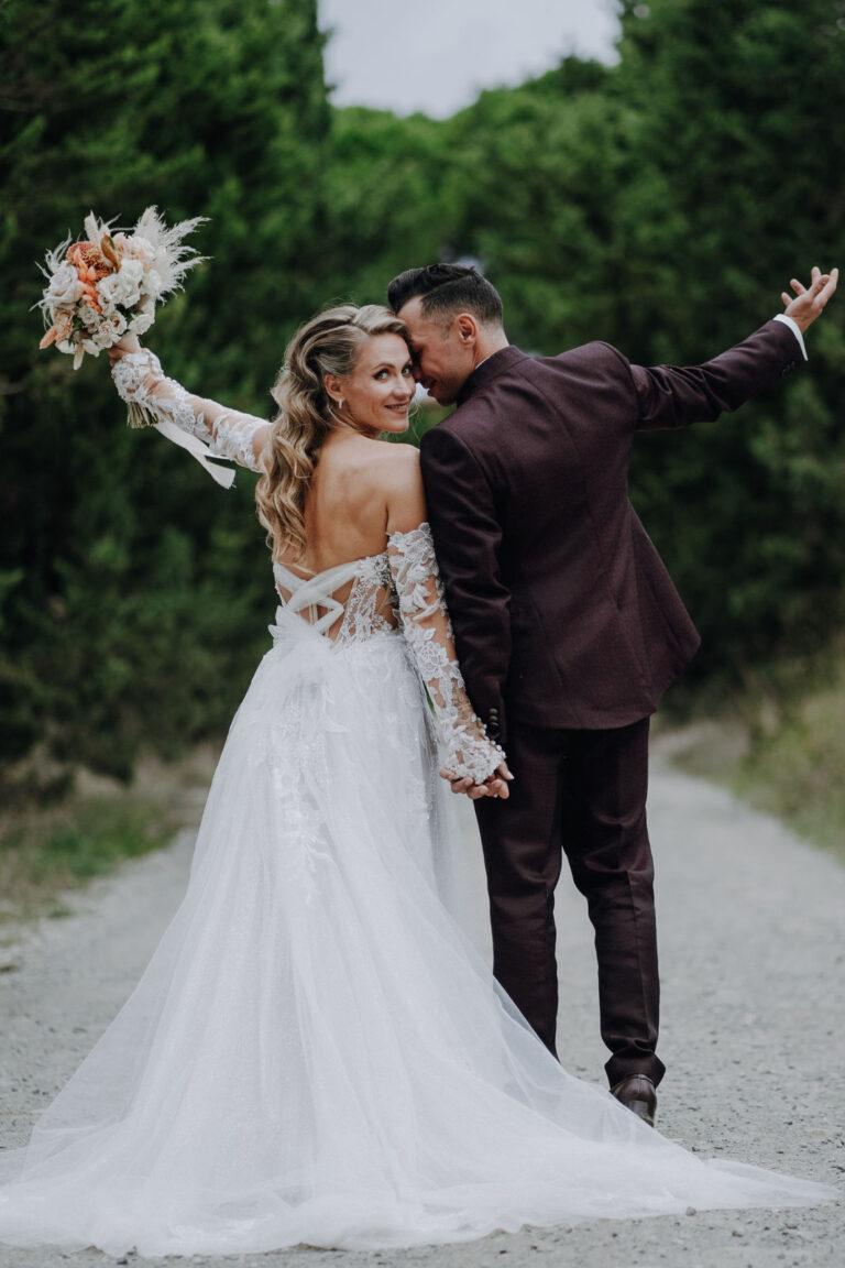 The newlyweds walk away along a country track after the ceremony, Dr Tiziana Di Molfetta