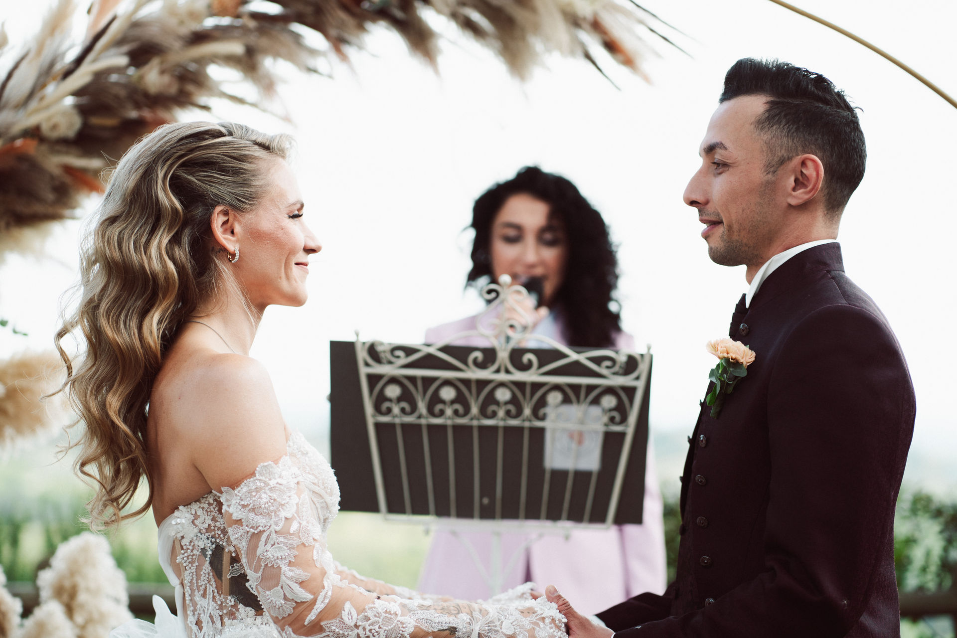 The celebrant reads the ceremony script as the couple hold hands, Dr Tiziana Di Molfetta