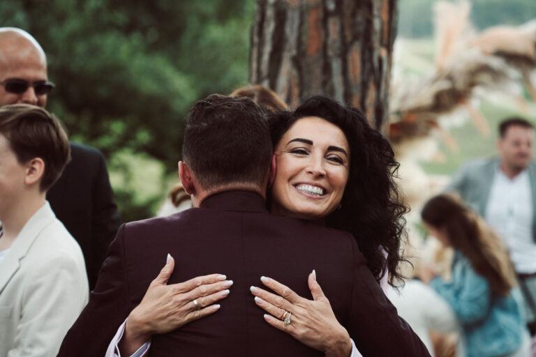 The celebrant is embraced by the groom after the ceremony, Dr Tiziana Di Molfetta