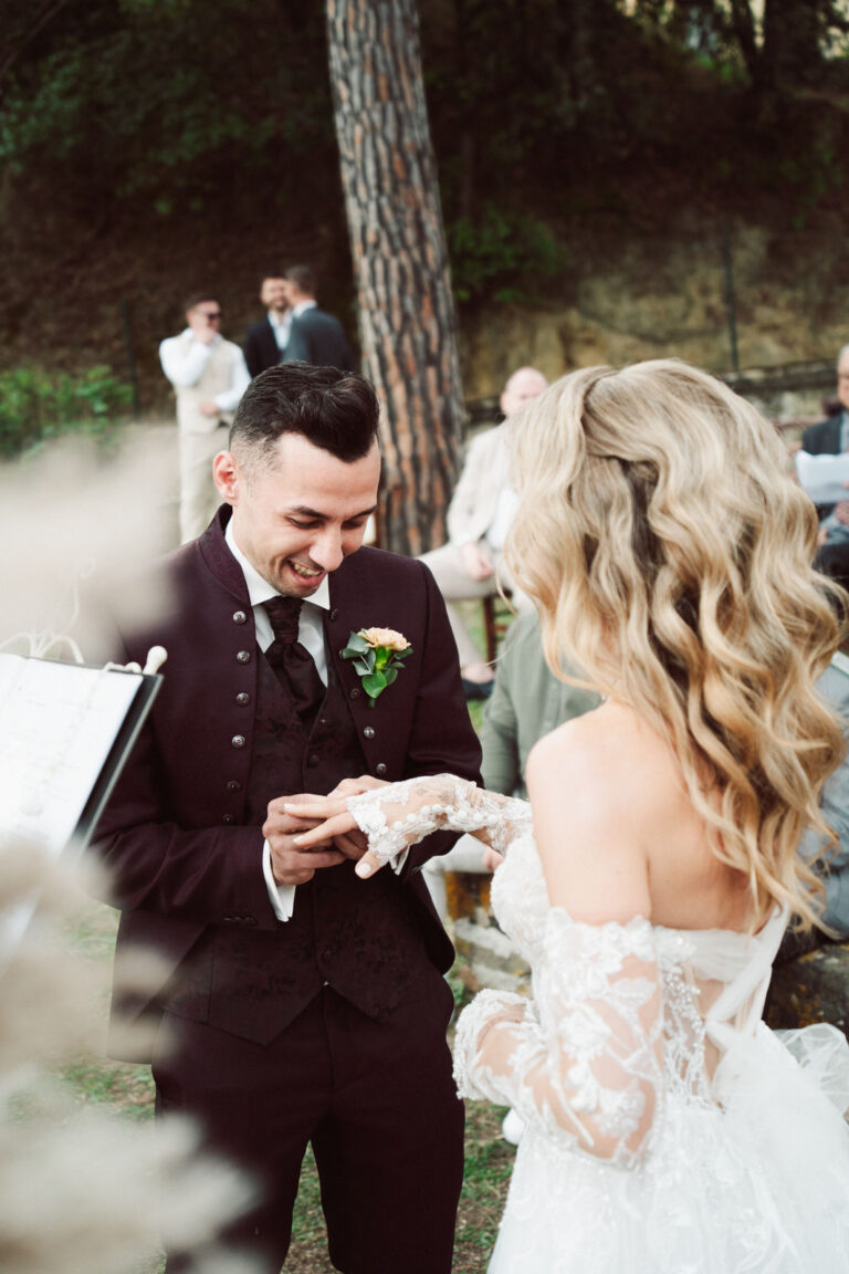 The groom places the ring on the bride during the ceremony, Dr Tiziana Di Molfetta