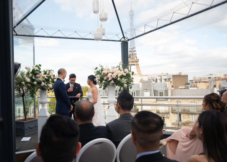Rooftop ceremony with white chairs and the Eiffel Tower beyond, Dream Paris Wedding
